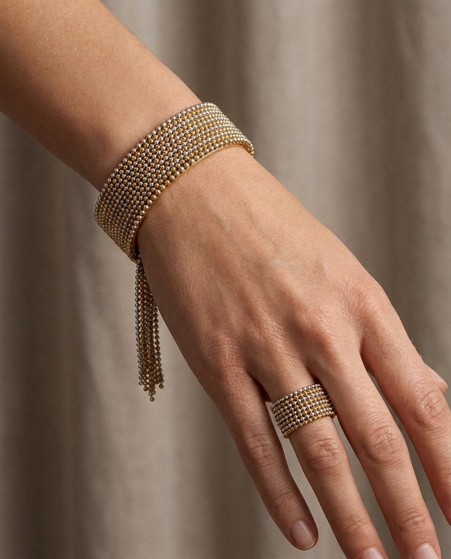 Cascade Fringe Cuff, Two-Tone finish, worn on a single wrist with the matching Beaded Tassel Ring