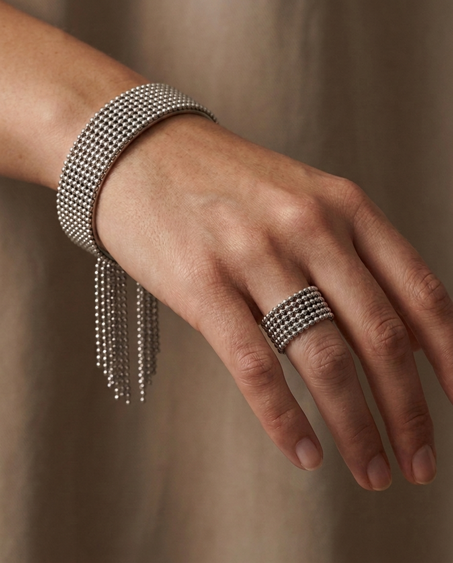 Cascade Fringe Cuff, Silver finish, worn on a single wrist with the matching Beaded Tassel Ring