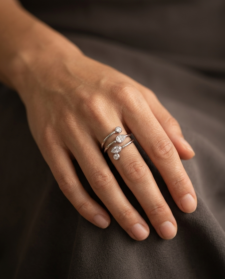 Spiral Teardrop Ring, Silver finish, worn on a relaxed hand