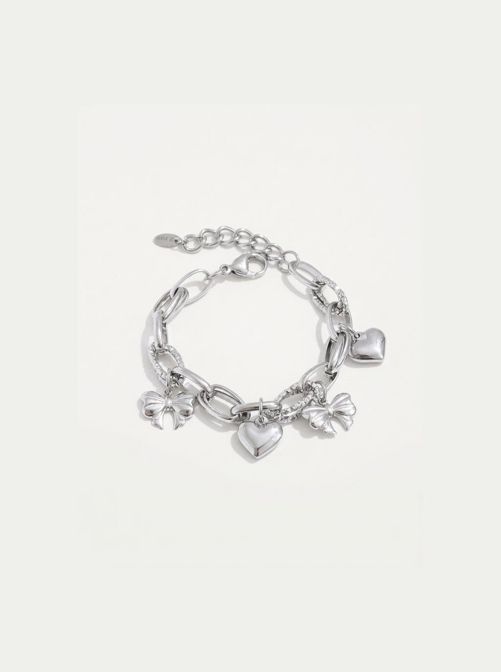 Heart and Bow Charm Bracelet, Silver finish, studio product shot