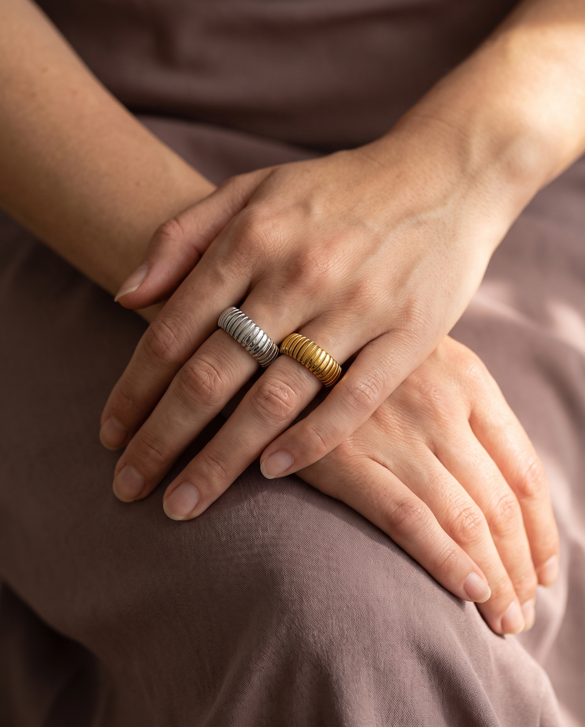 Tubogas Open Ring, Gold and Silver finishes stacked on the same hand, openings concealed