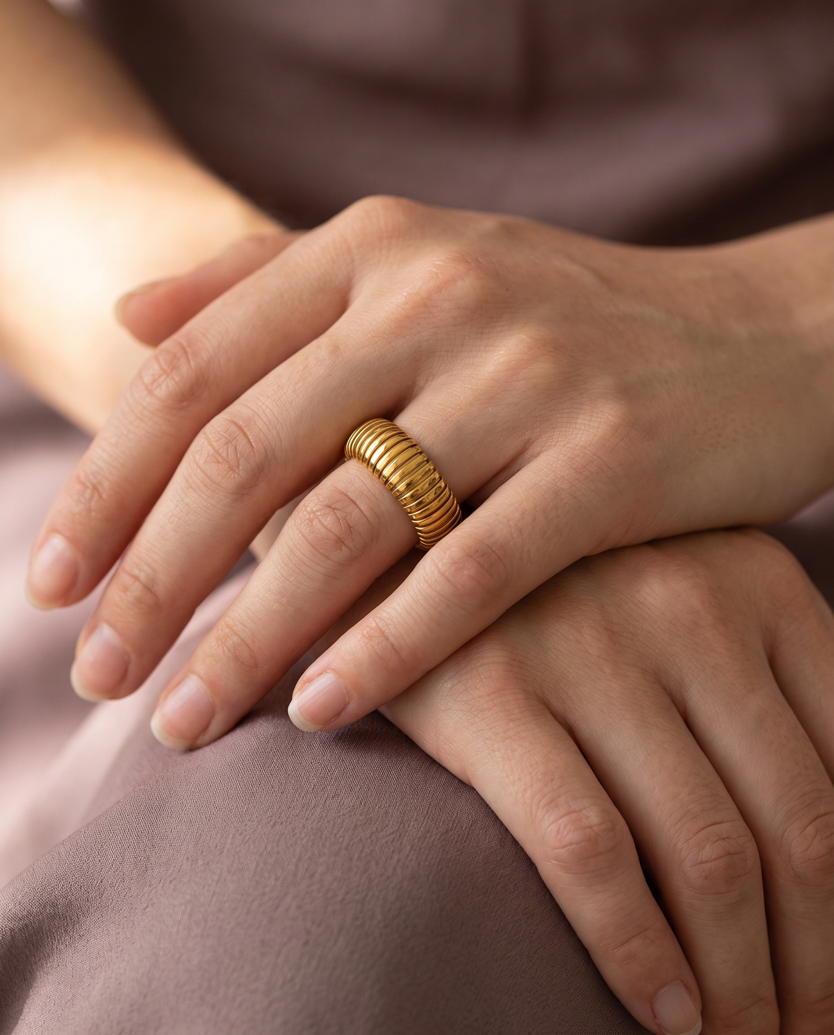 Tubogas Open Ring, Gold finish, worn on a relaxed hand